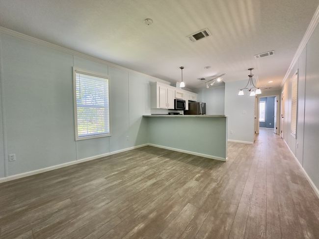 Living room facing Bedroom 2 (open door) | Image 8