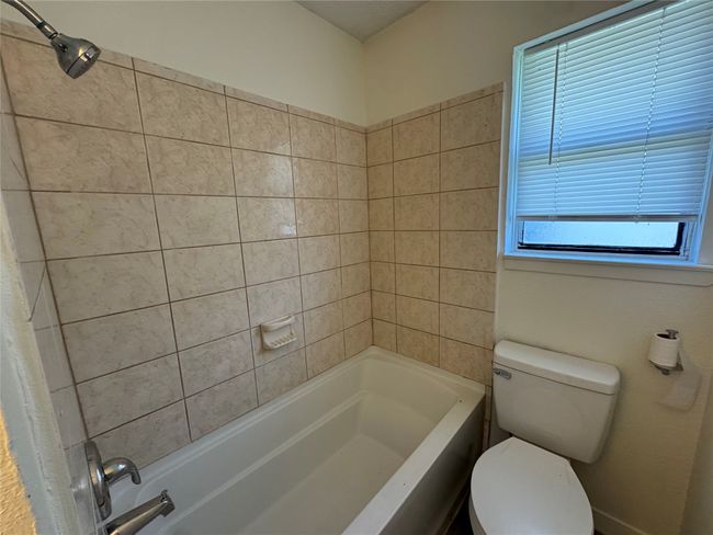 Full bathroom with toilet and shower combination | Image 19