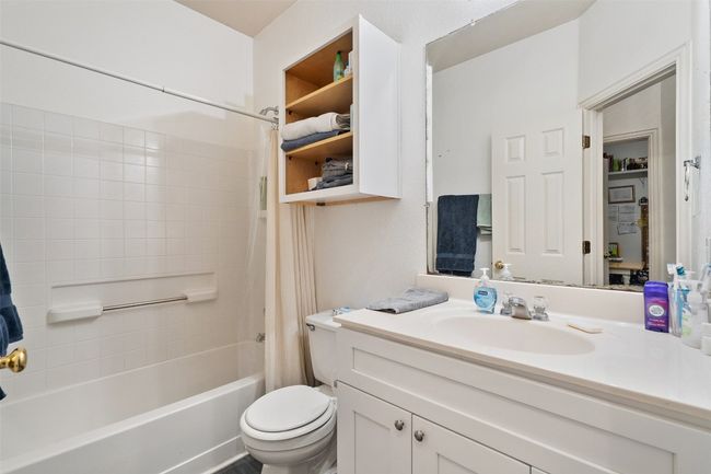 Two additional bedrooms with large closets share a perfectly placed second full bath in the hallway. | Image 30