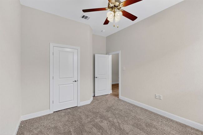 Unfurnished bedroom featuring carpet floors and ceiling fan | Image 29
