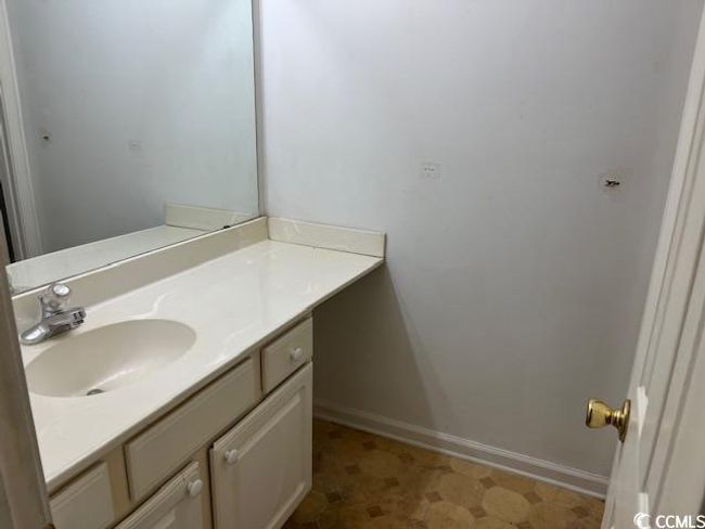 Bathroom with vanity and tile patterned floors | Image 8