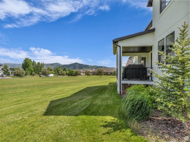 View of grassy yard with a mountain view | Image 46