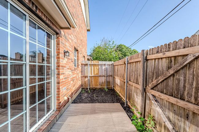 View of fenced backyard | Image 27