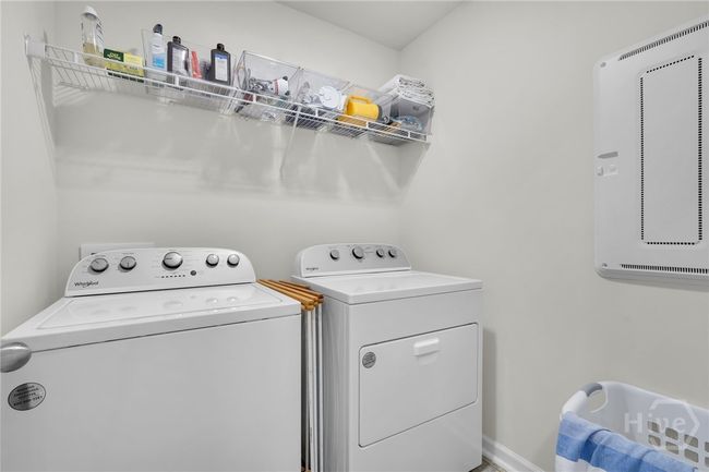 Laundry room upstairs with closet access behind the door to the HVAC mechanicals. | Image 37