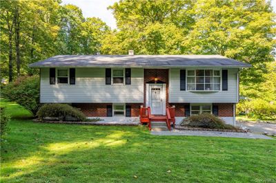 Split foyer home featuring a front lawn | Image 1