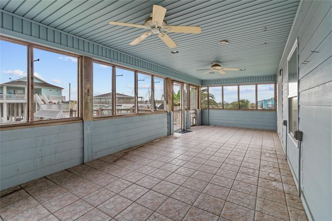 Outside covered deck that overlooks the Canal. | Image 13