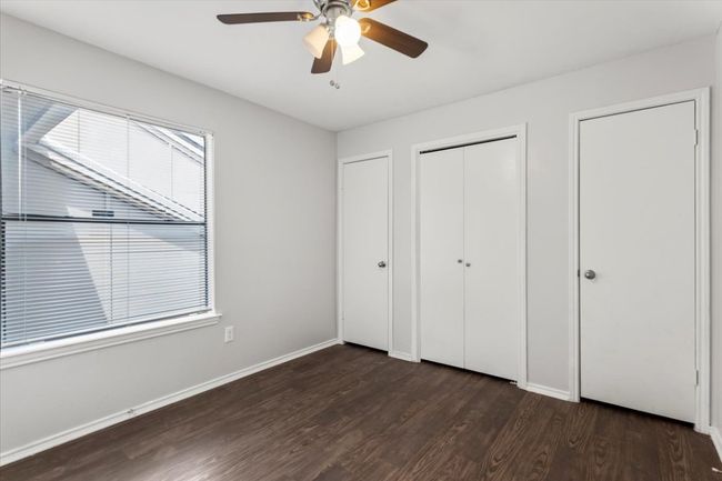 Back bedroom with window allowing sunlight to brighten room | Image 18