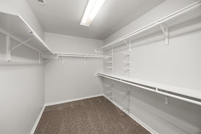 Generous Primary Walk-In Closet with Ample Storage | Image 28