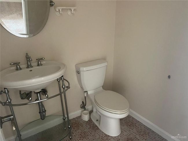 Bathroom featuring toilet and tile patterned flooring | Image 11