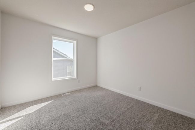 (*Photo of actual home) One of the upper level secondary bedrooms | Image 14