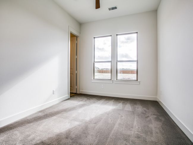 Empty room with carpet and ceiling fan | Image 17