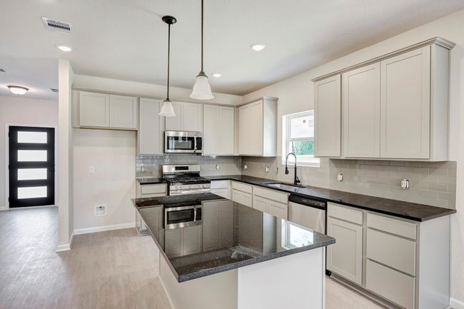 The Davenport II- Kitchen. Home under construction. Sample floor plan photo used for illustrative purposes only. Upgrades, selections options, windows and colors may vary. | Image 5