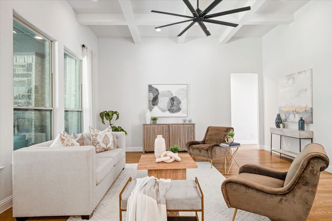 Living room with coffered ceiling, wood finished floors, ceiling fan, beam ceiling, and recessed lighting | Image 7