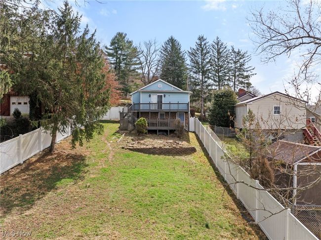 View of yard with a fenced backyard and a wooden deck | Image 24