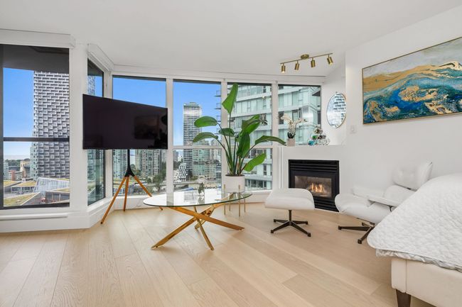 View of property's community featuring fence, volleyball court, and a view of city | Image 7