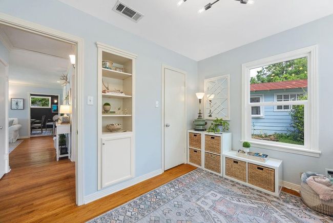 Alt view of bedroom #2. Notice the built-ins and the door to a full closet. | Image 19