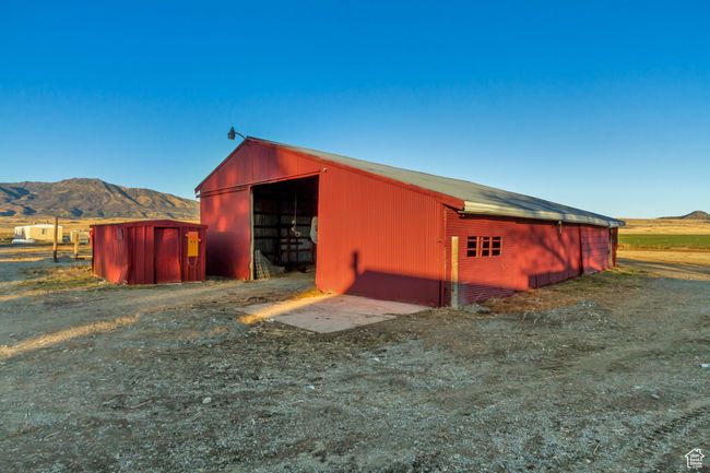 View of chicken coop on the left and barn on the right | Image 14
