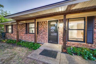 View of exterior entry featuring covered porch | Image 2