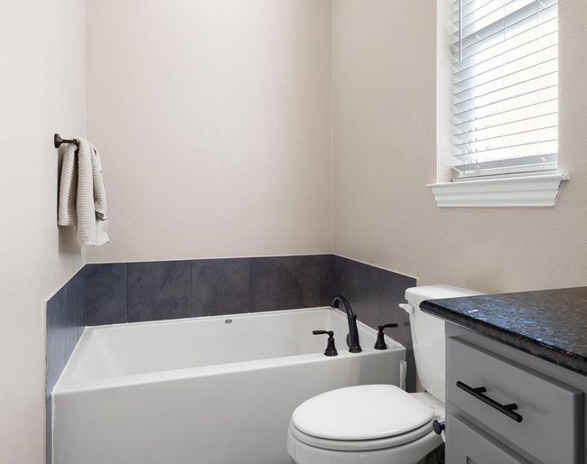 Full bath with a garden tub, toilet, and vanity | Image 27