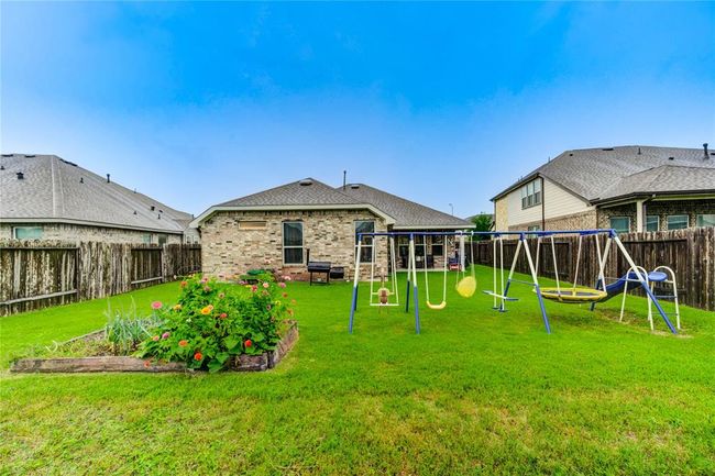 Large fully fenced back yard with plenty of room for a garden or a pool! | Image 36