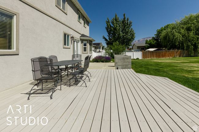 Wooden terrace with outdoor dining area and a mountain view | Image 39