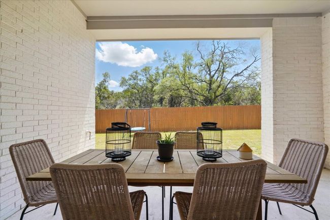 Fenced backyard featuring outdoor dining area | Image 30