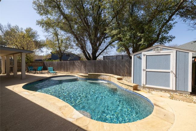 View of swimming pool and storage shed | Image 19