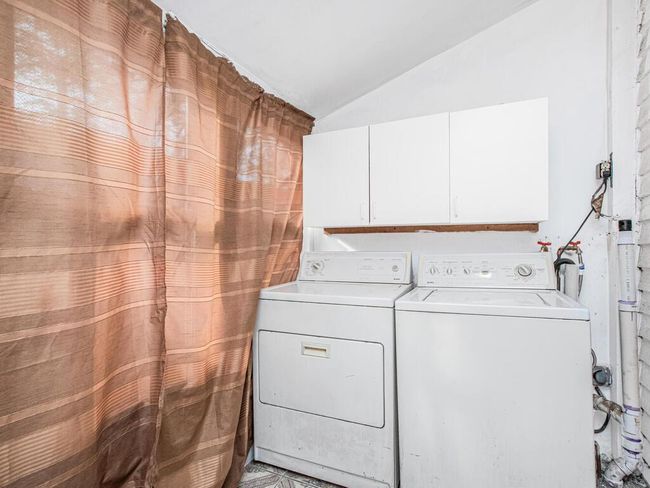 Clothes washing area with washer and clothes dryer | Image 7
