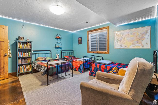 Bedroom with a textured ceiling | Image 41