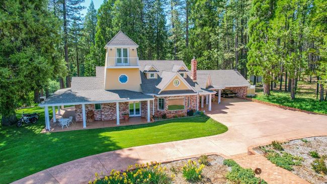What a joy to come home to this unique custom built home in the heart of Apple Hill. Holidays will be fun with your own Christmas tree farm! Numerous fruit trees will keep you loving living life in Camino with the fresh air and peaceful setting. Apple ranches and delicious wineries close by. | Image 56