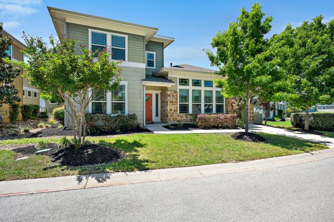 View of front of house with a front lawn and stone siding | Image 4
