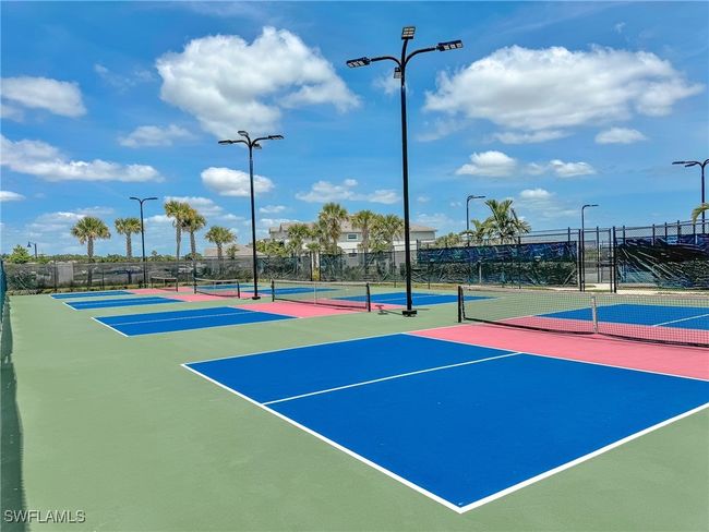 View of tennis court featuring community basketball court and fence | Image 47
