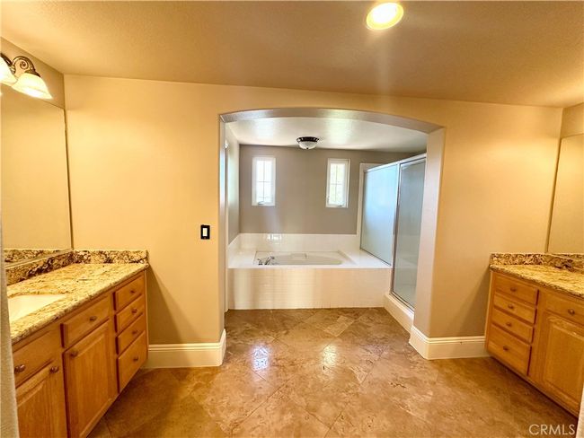 Large primary bathroom with dual vanities, large soaking tub, and separate walk-in shower | Image 7