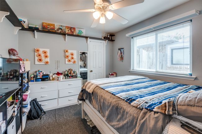 Bedroom featuring dark carpet and ceiling fan | Image 19