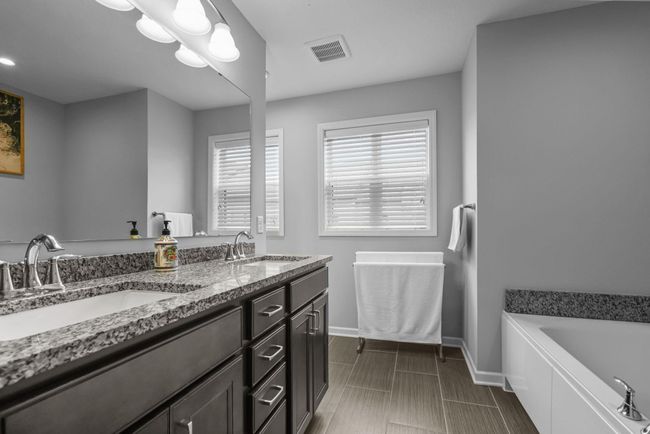 Double sink vanity in the Primary Suite bathroom. | Image 24