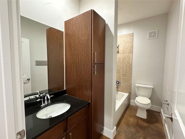 Bathroom 1. featuring vanity, cabinets and shower / bathtub combination | Image 9
