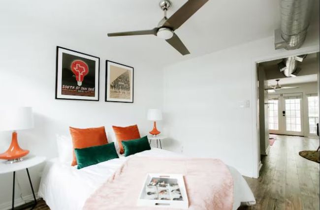 Bedroom with wood finished floors, french doors, and a ceiling fan | Image 16