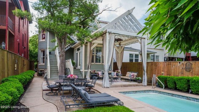 The oversized pergola in rear yard makes for great entertaining. | Image 44