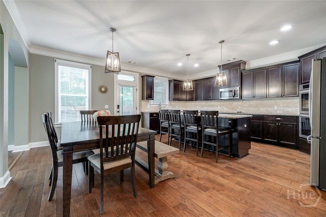 Access to screen porch, patio and private backyard from the kitchen. | Image 13
