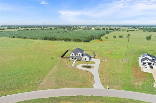 Aerial view of sparsely populated area with agricultural land | Image 4