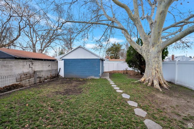 View of yard with a fenced backyard and an outbuilding | Image 15