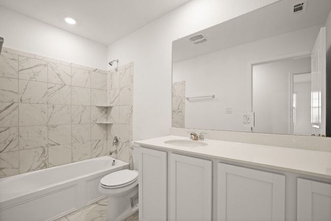 Full bath with shower / bath combination, visible vents, toilet, marble finish floor, and vanity | Image 22