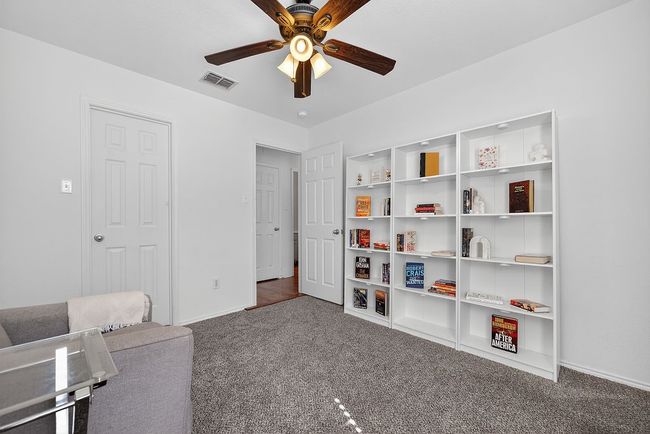 Sitting room featuring carpet and ceiling fan | Image 10