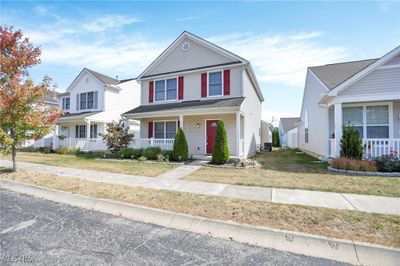 Front facade featuring central AC, a front yard, and a porch | Image 3