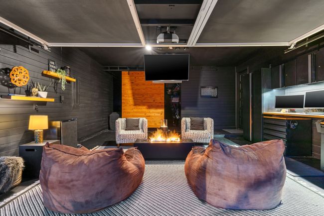 Living room featuring wood walls and track lighting | Image 4