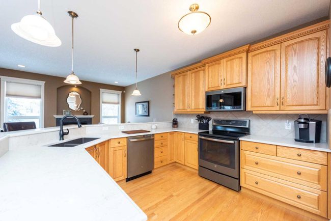 1212 Woodside Way Nw, Home with 4 bedrooms, 2 bathrooms and 4 parking in Airdrie AB | Image 7