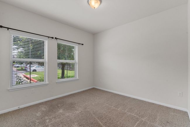 Carpeted empty room featuring baseboards | Image 22