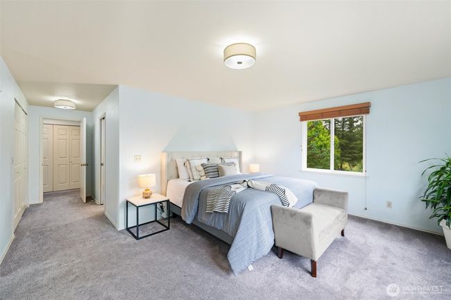 The primary suite has an en- suite bathroom, ample closets and an attached flex space perfect for a dressing room, additional bedroom, relaxation room, exercise room or what ever you can dream up. | Image 18