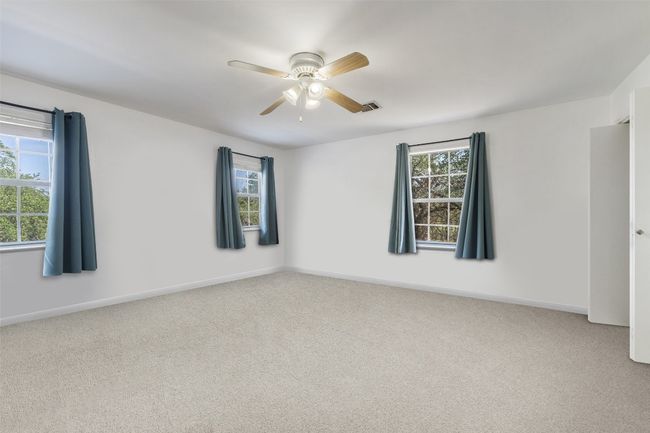 Spare room with carpet flooring, a ceiling fan, and baseboards | Image 30