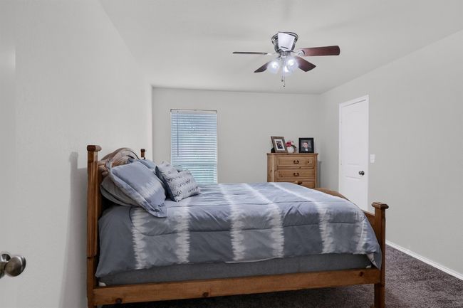 Carpeted bedroom featuring baseboards and ceiling fan | Image 20